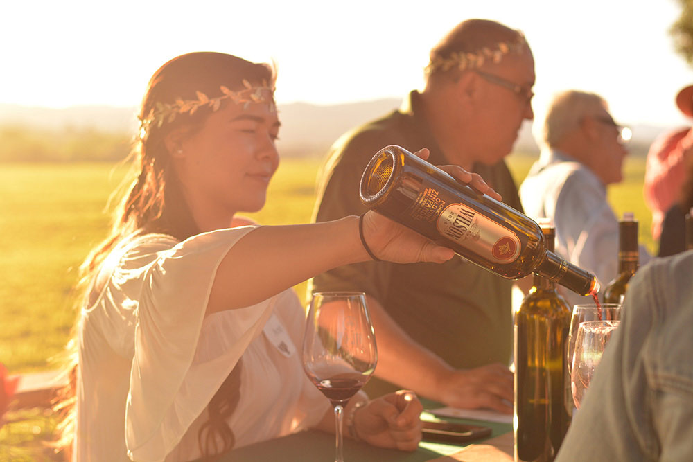 Winery Employee pouring wine image